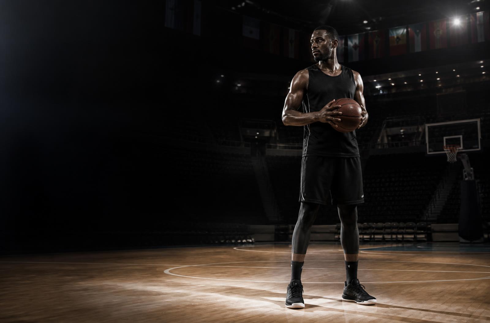 Professional basketball player on an international arena court